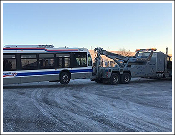 Large Bus Being Towed
